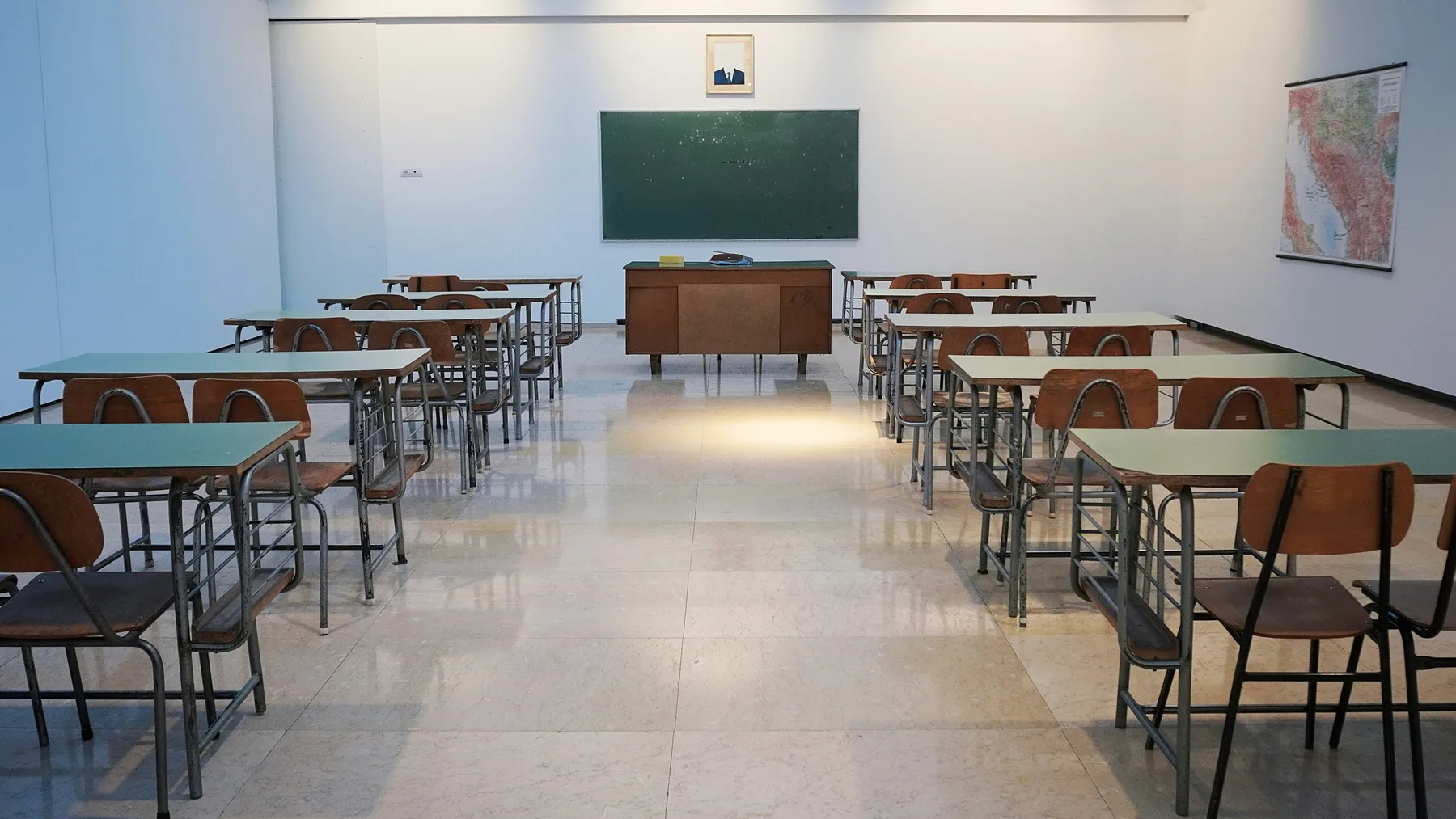Classroom with rows of desks facing the front of the room