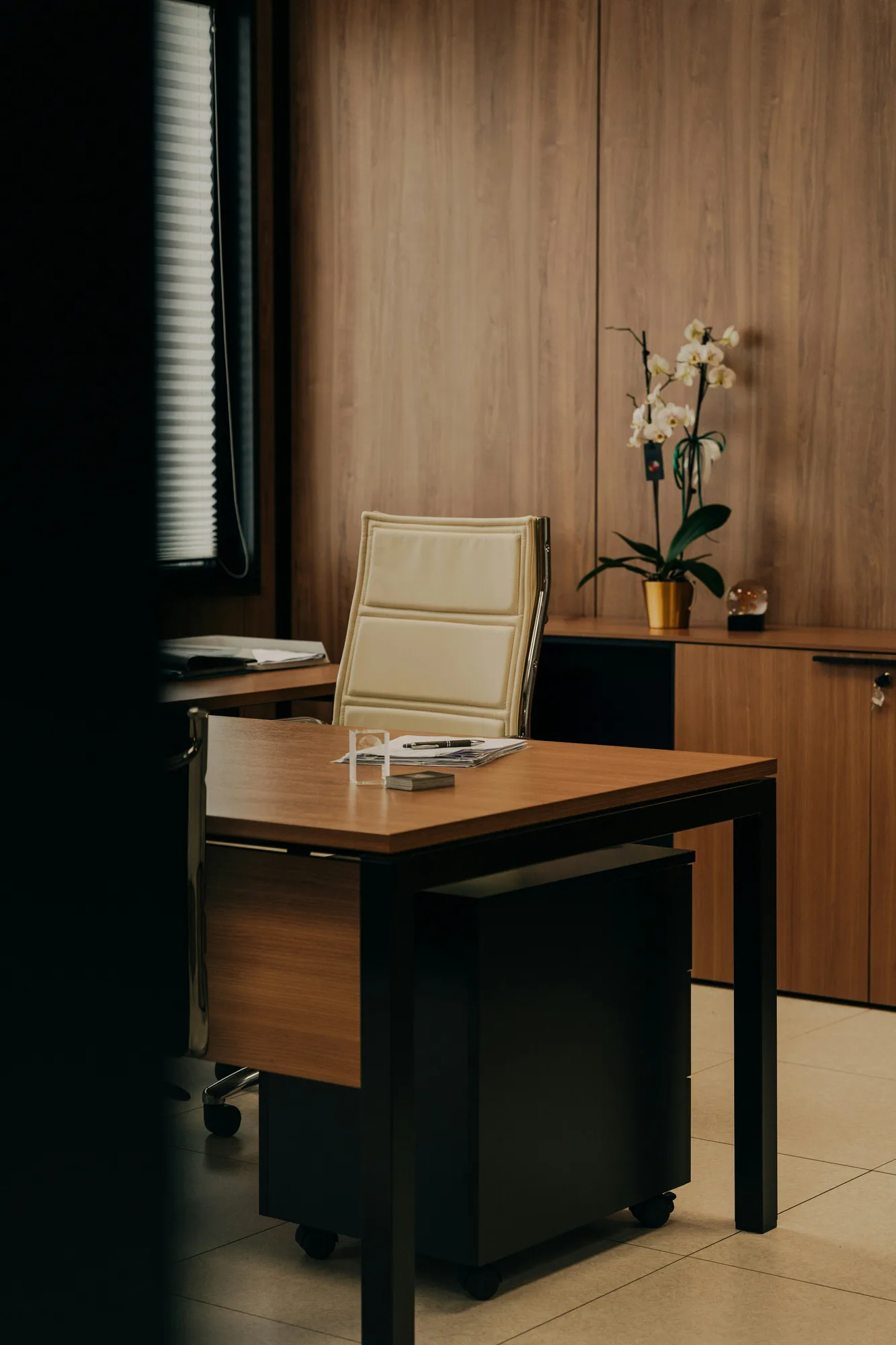 Warm private office with a desk and executive chair
