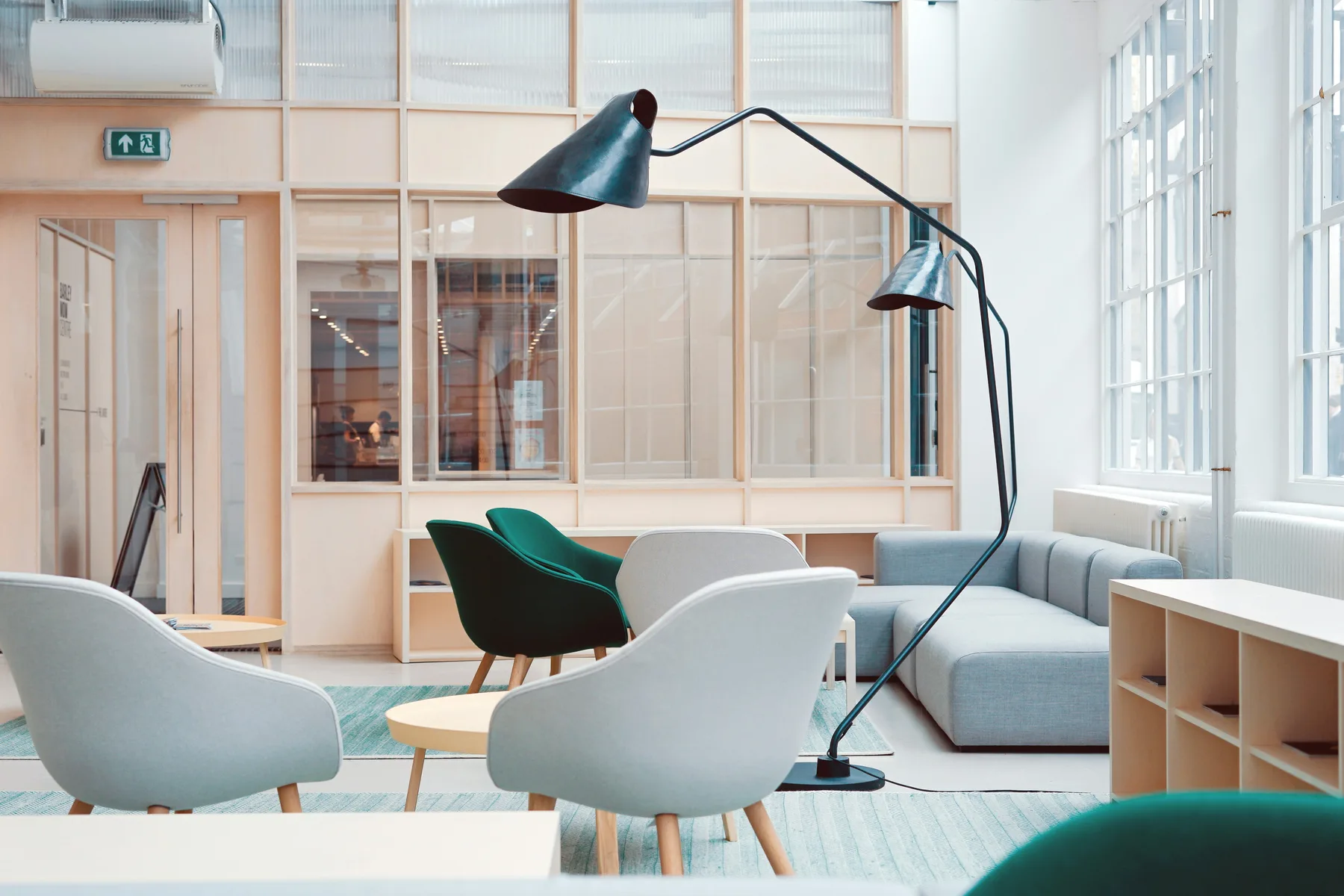 Comfortable shared lounge seating in a bright modern workspace